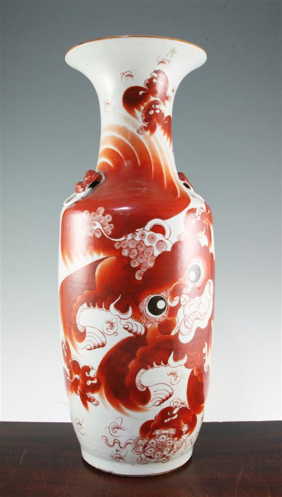 A Chinese iron red painted lion-dog baluster vase, late 19th / early 20th century, 59.5cm